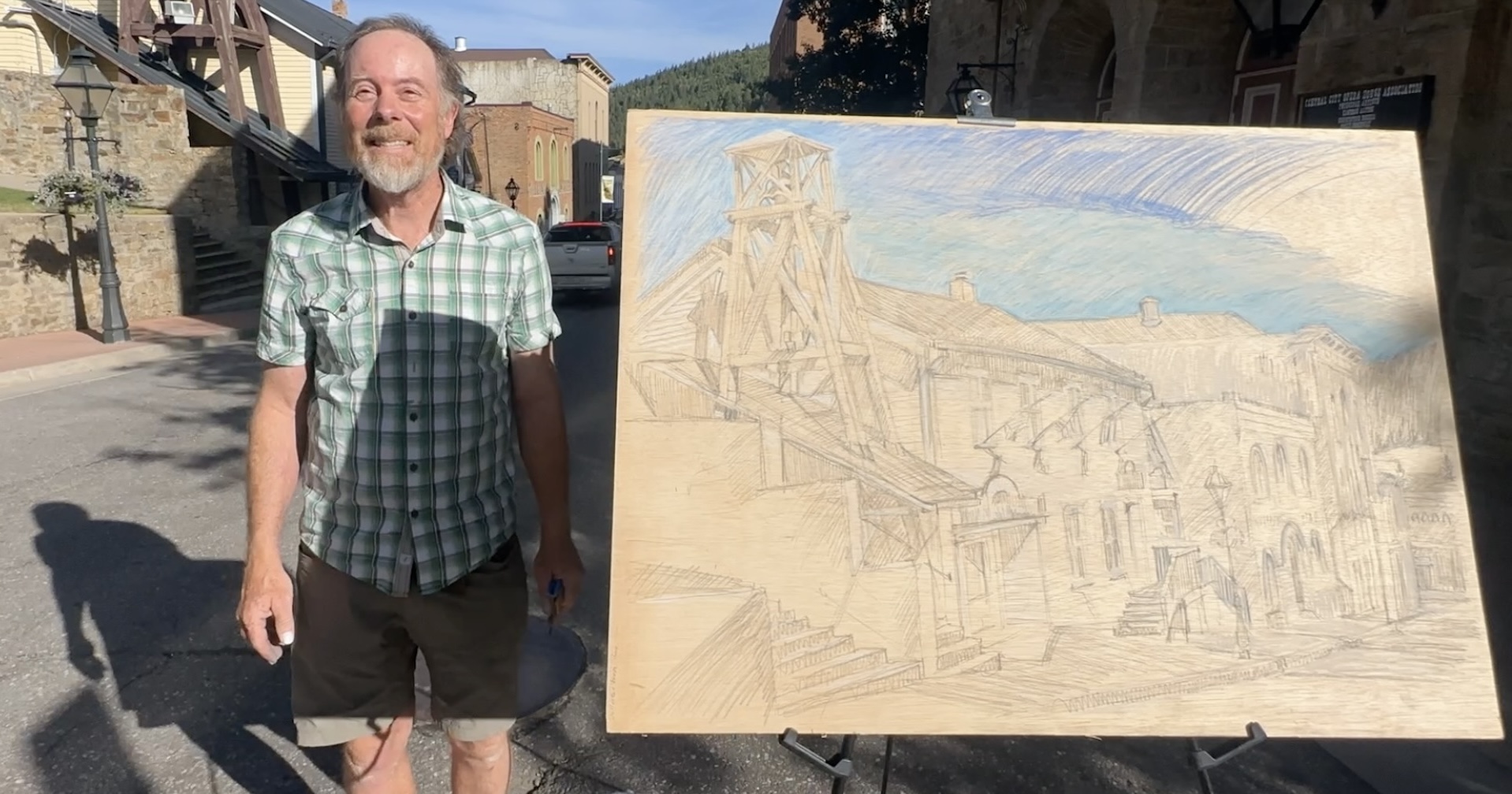 picture of Jonathan Machen with a plein-air drawing he made in Central City, CO