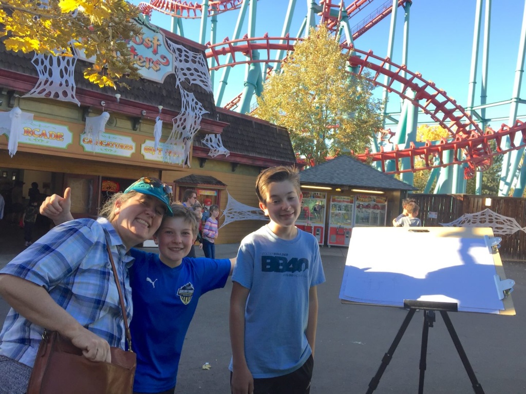 Picture of a family at Elitch Gardens in front of the Mind Eraser ride. Photo by Jonathan Machen